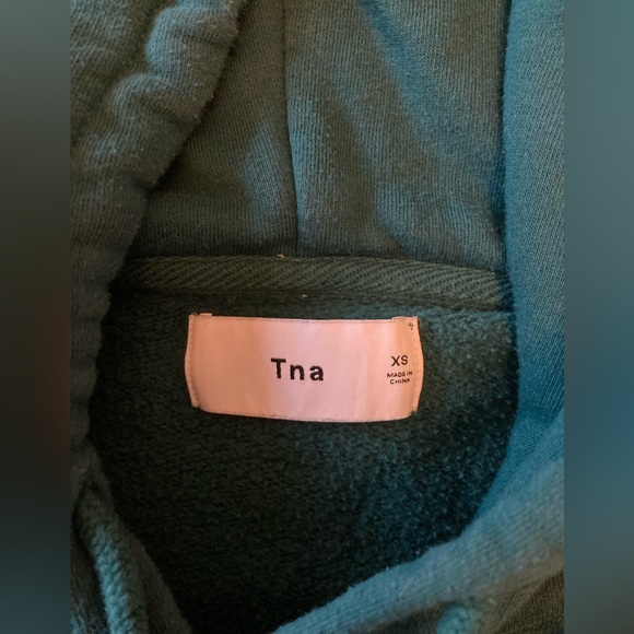 Forest green TNA sweater with cool design on the sleeves and back side. - Picture 3 of 3